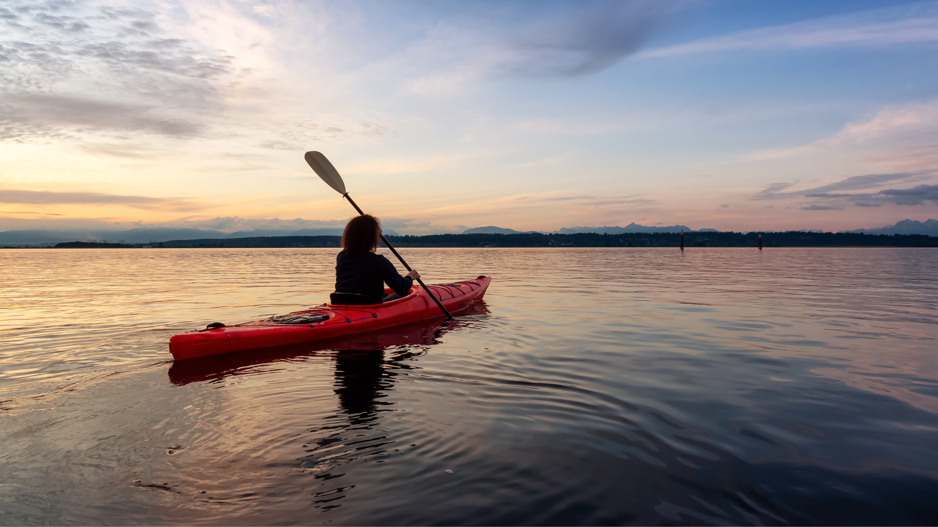 Blog10 Image: Woman Kayakking during the sunset